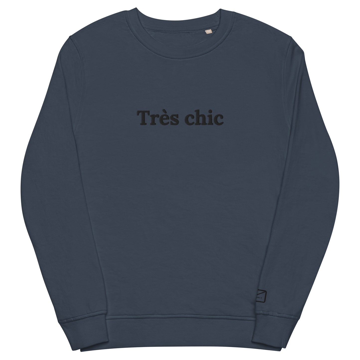 Dark blue crew neck sweatshirt featuring the embroidered phrase "Très Chic" in subtly black lettering across the chest.