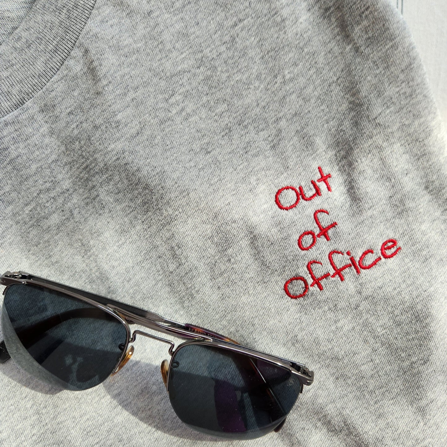 Grey t-shirt with the phrase "Limited edition 1/1" in red lettering on the upper left chest