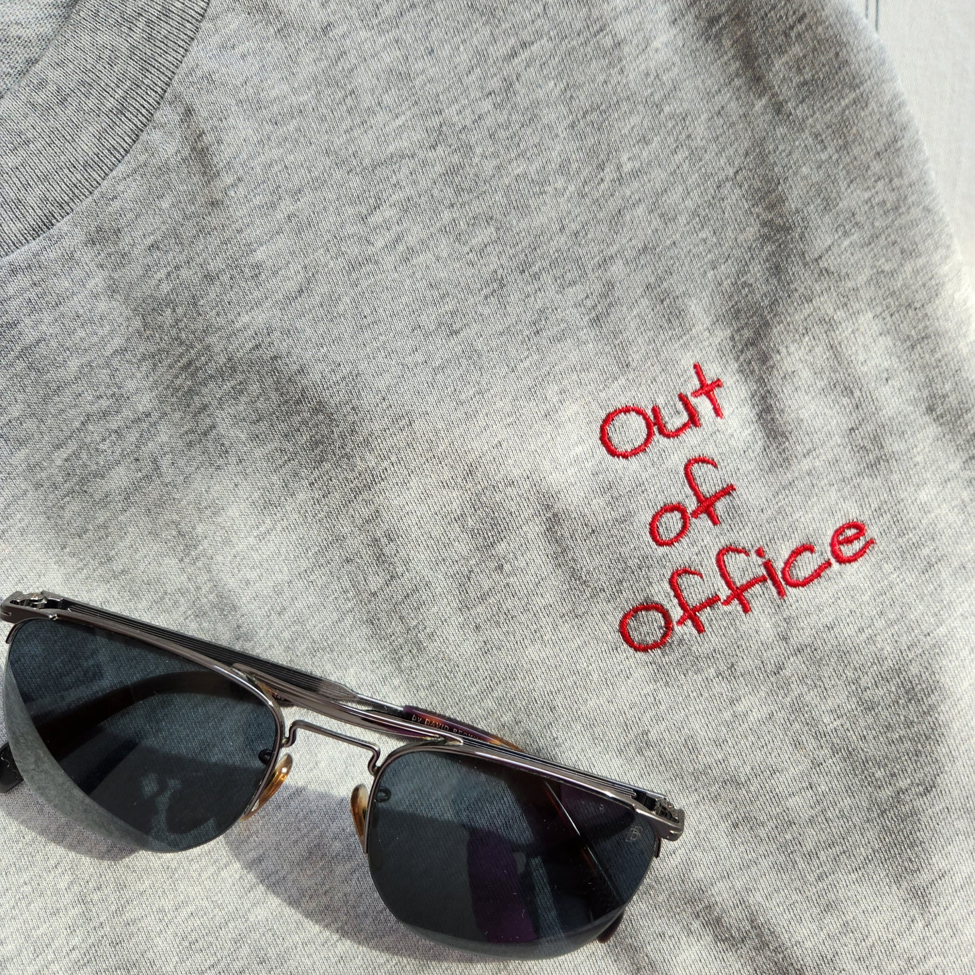 Grey t-shirt with the phrase "Limited edition 1/1" in red lettering on the upper left chest