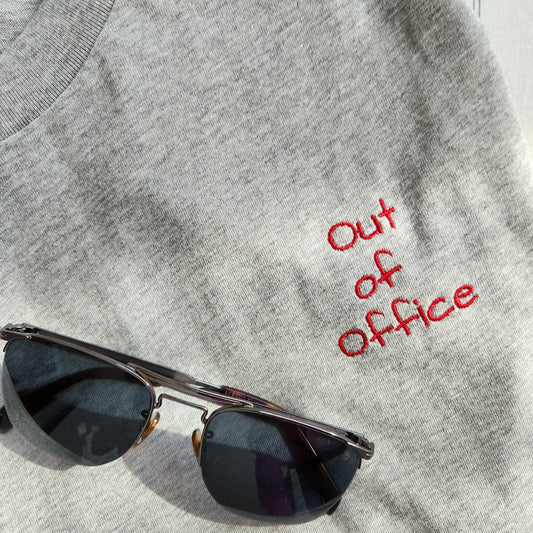 Grey t-shirt with the phrase "Limited edition 1/1" in red lettering on the upper left chest