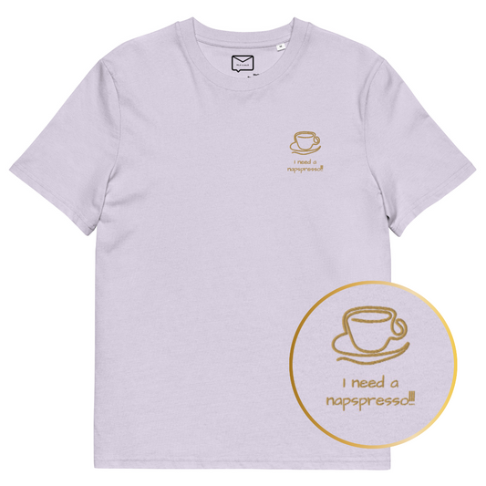Light lavender t-shirt with a small brown graphic of a coffee cup and the text "I need a napspresso!!" in brown lettering on the upper left chest