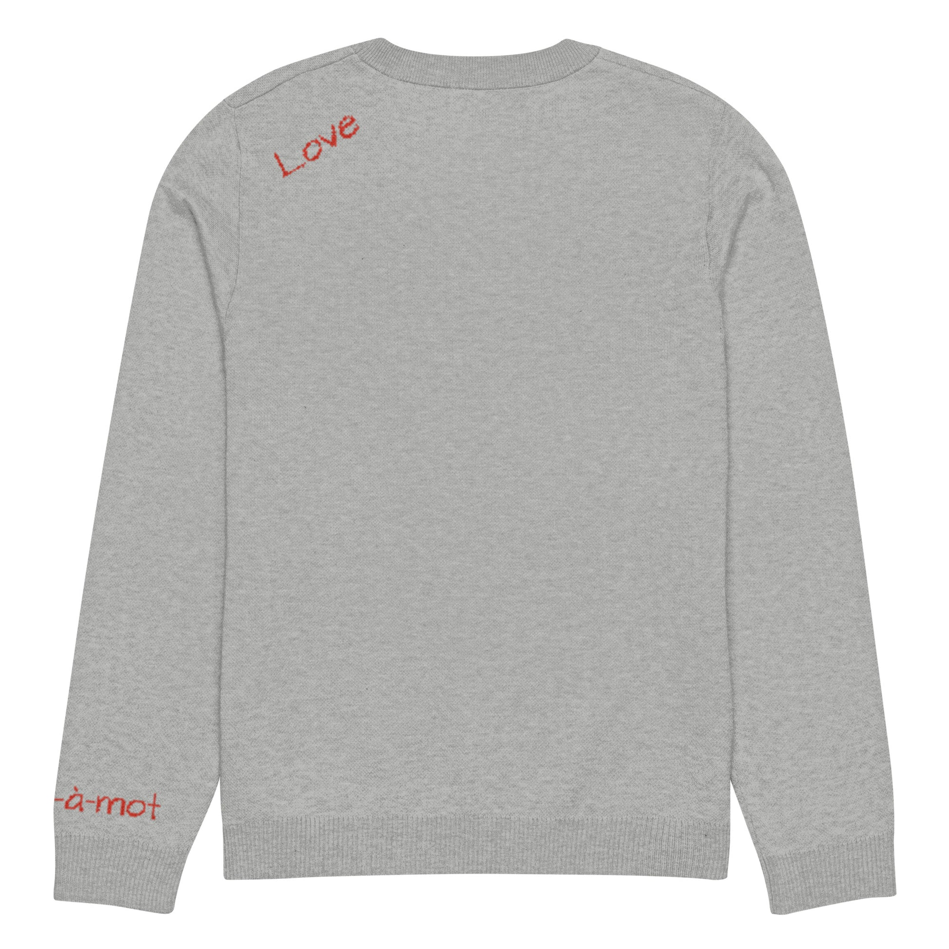 Back view of a grey knitted jumper with a ribbed neckline and cuffs, featuring the word "Love" embroidered in red cursive script on the upper back. A small brand tag "mot-à-mot" is visible on the lower left sleeve