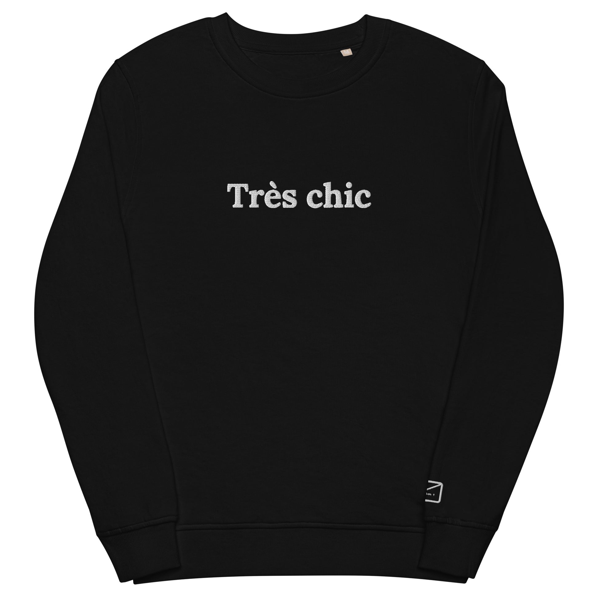 Black crew neck sweatshirt featuring the embroidered phrase "Très Chic" (very chich) in white lettering across the chest.