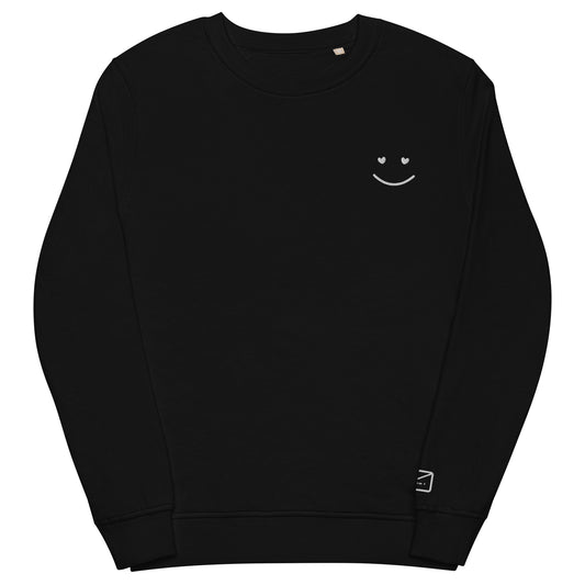 Black crew neck sweatshirt featuring a small, delicate white embroidered smiley face on the left side of the chest