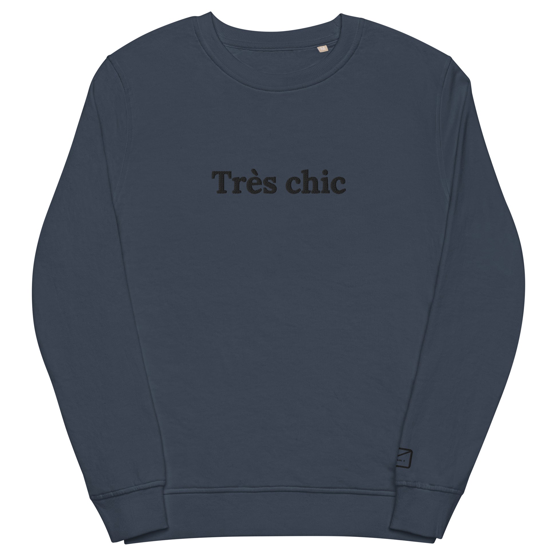 Dark blue crew neck sweatshirt featuring the embroidered phrase "Très Chic" in subtly black lettering across the chest.