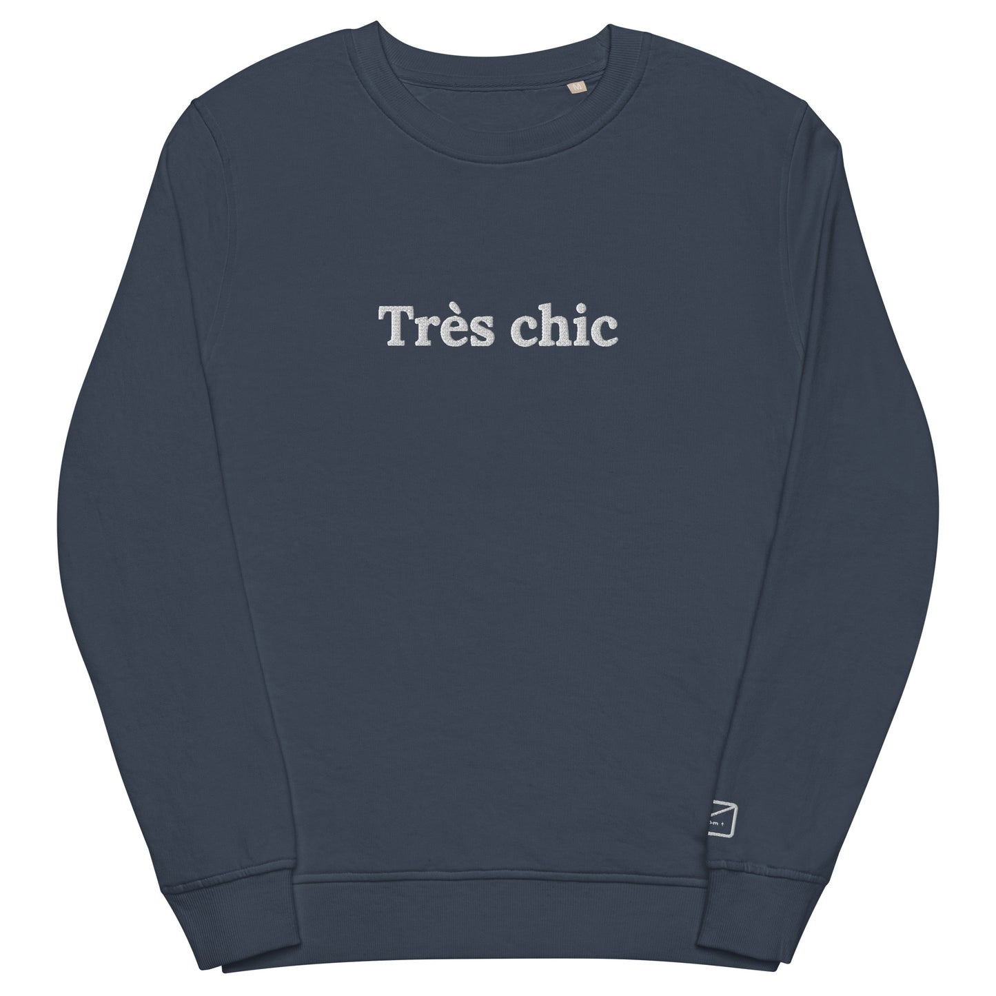 Dark blue crew neck sweatshirt featuring the embroidered phrase "Très Chic" (very chich) in white lettering across the chest.