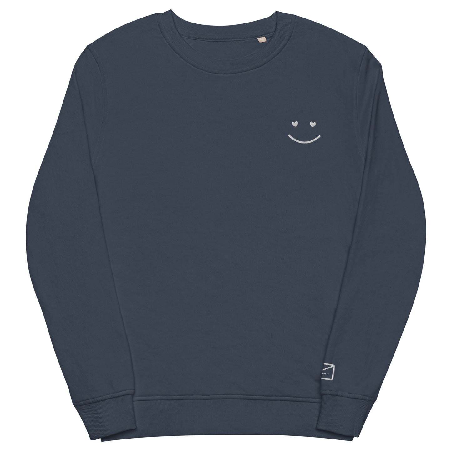 Dark blue crew neck sweatshirt featuring a small, delicate white embroidered smiley face on the left side of the chest