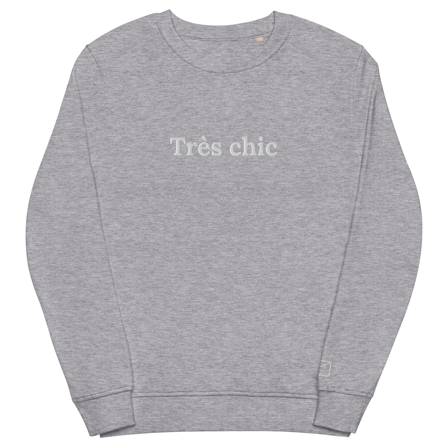 Grey crew neck sweatshirt featuring the embroidered phrase "Très Chic" (very chich) in white lettering across the chest.