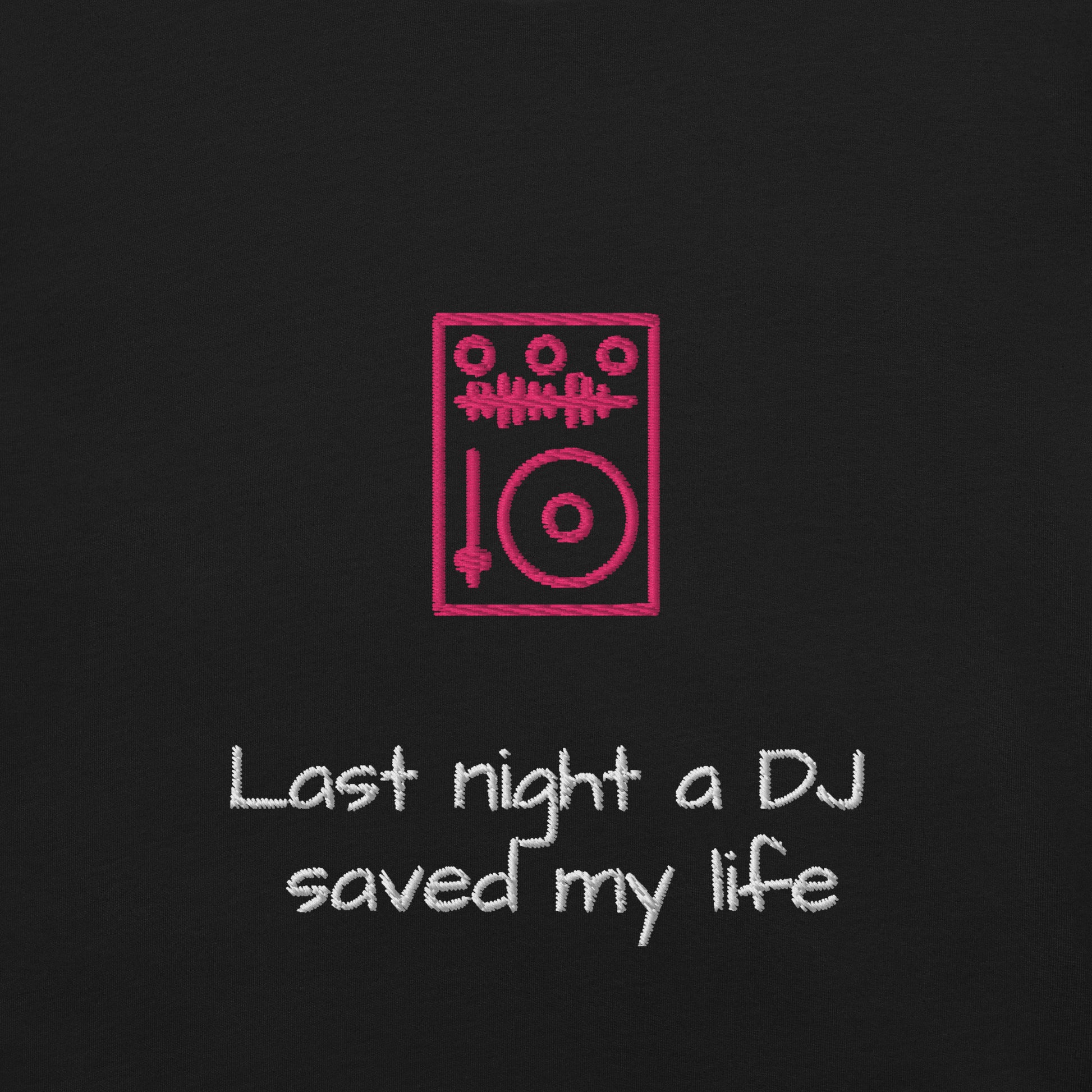 Details of an embroidery featuring a small, illustrated red DJ turntable and the iconic song lyric "Last night a DJ saved my life" in a simple red font beneath it