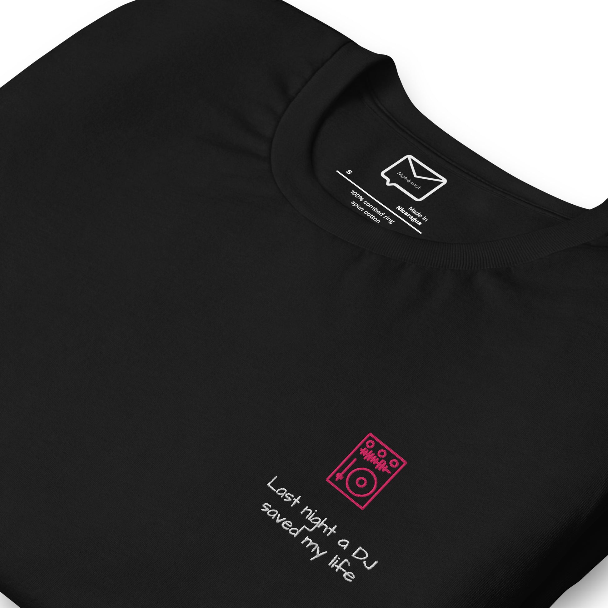 Front view of a black short-sleeved t-shirt featuring a small, illustrated red DJ turntable and the iconic song lyric "Last night a DJ saved my life" in a simple red font beneath it, located on the left side of the chest